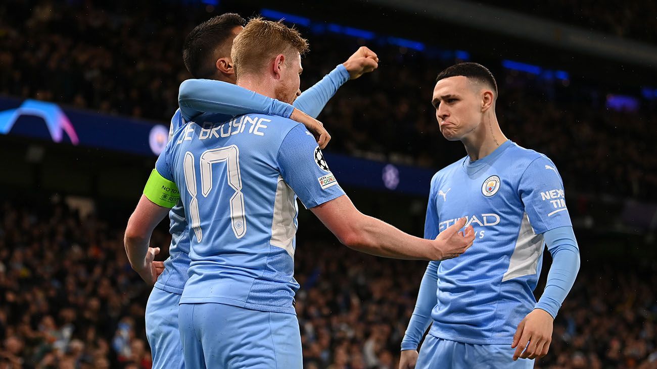 Phil Foden celebrates with his Manchester City teammates