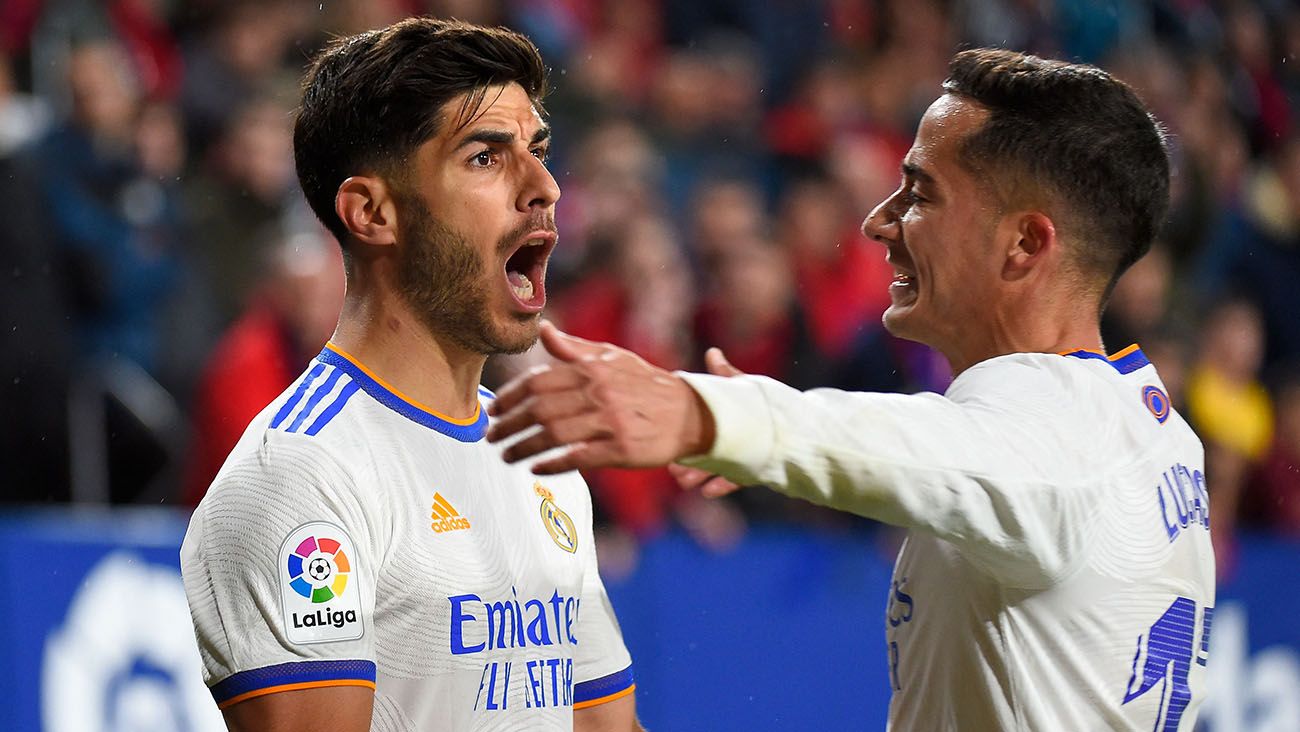 Marco Asensio and Lucas Vázquez celebrate a goal against Osasuna