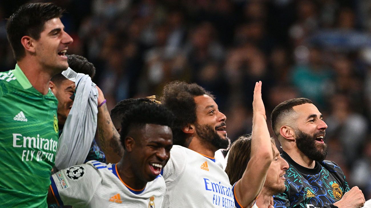 Real Madrid players celebrate after eliminating City