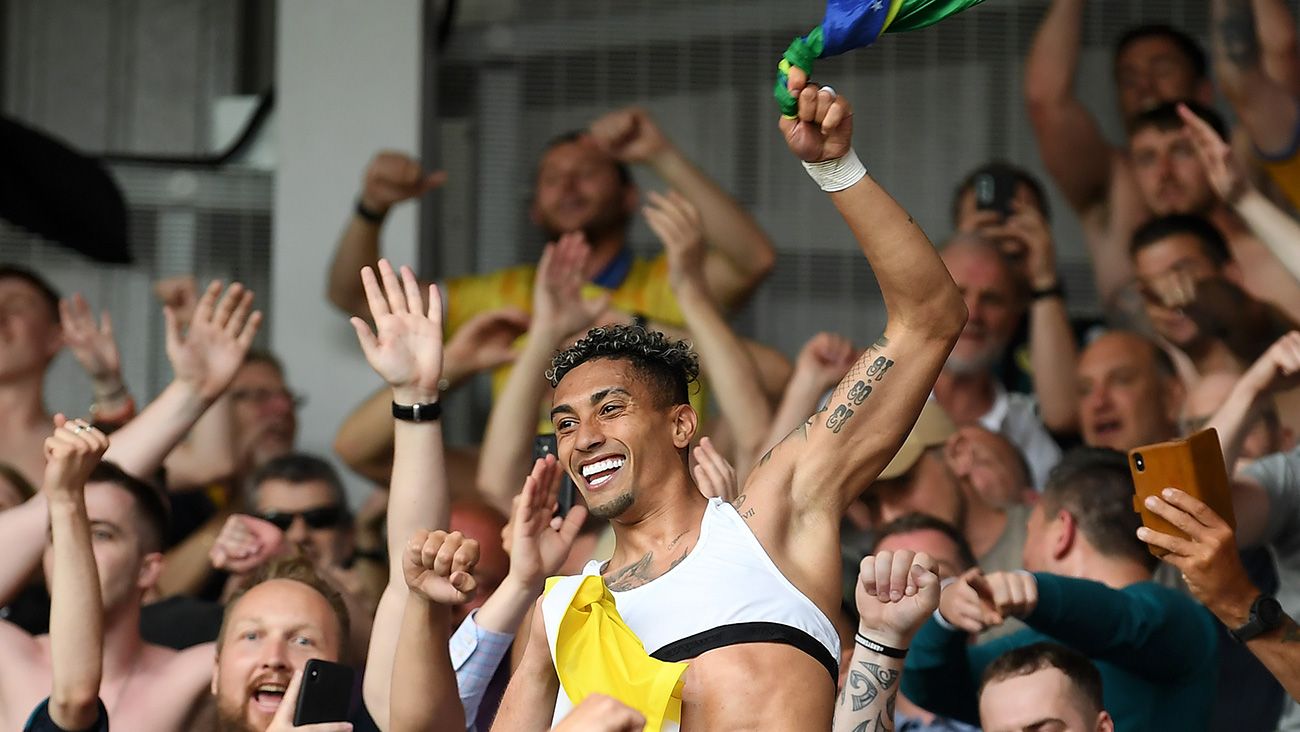 Raphinha celebrating with Leeds fans