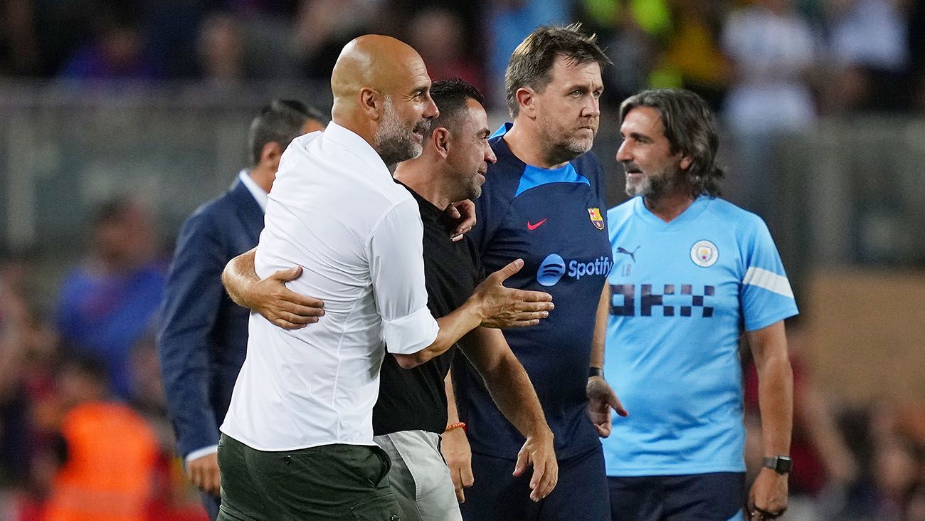 Pep Guardiola jokes with Xavi Hernández after the friendly Barça-City