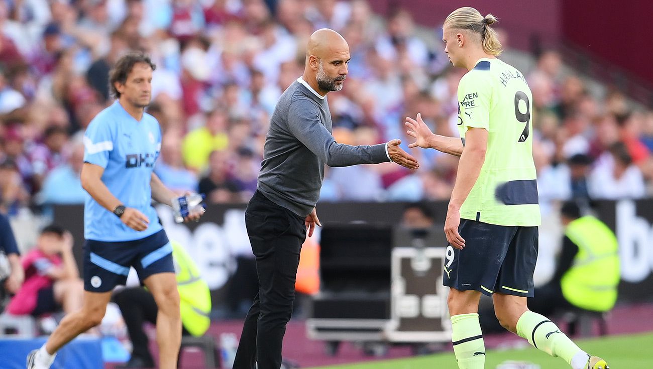 Pep Guardiola y Erling Haaland durante un partido