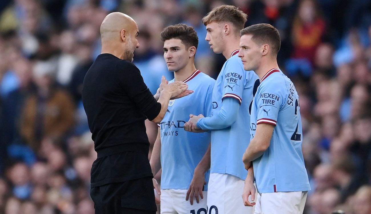 Pep Guardiola at City with some players
