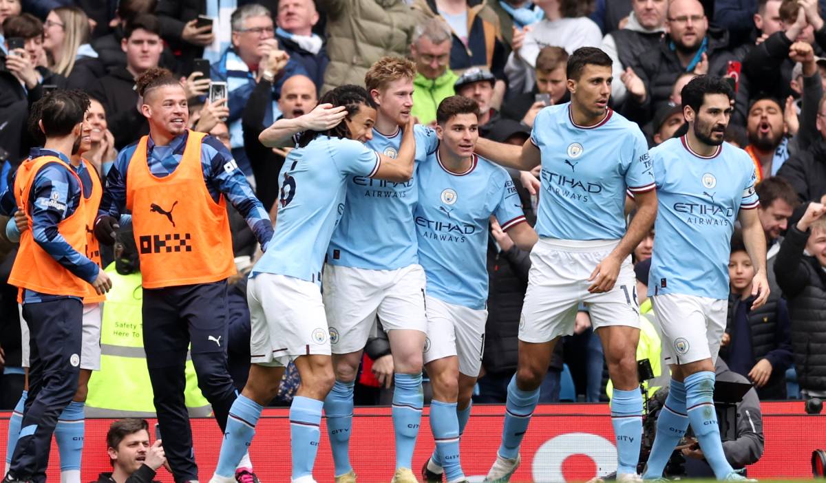 City players celebrate a goal vs Liverpool