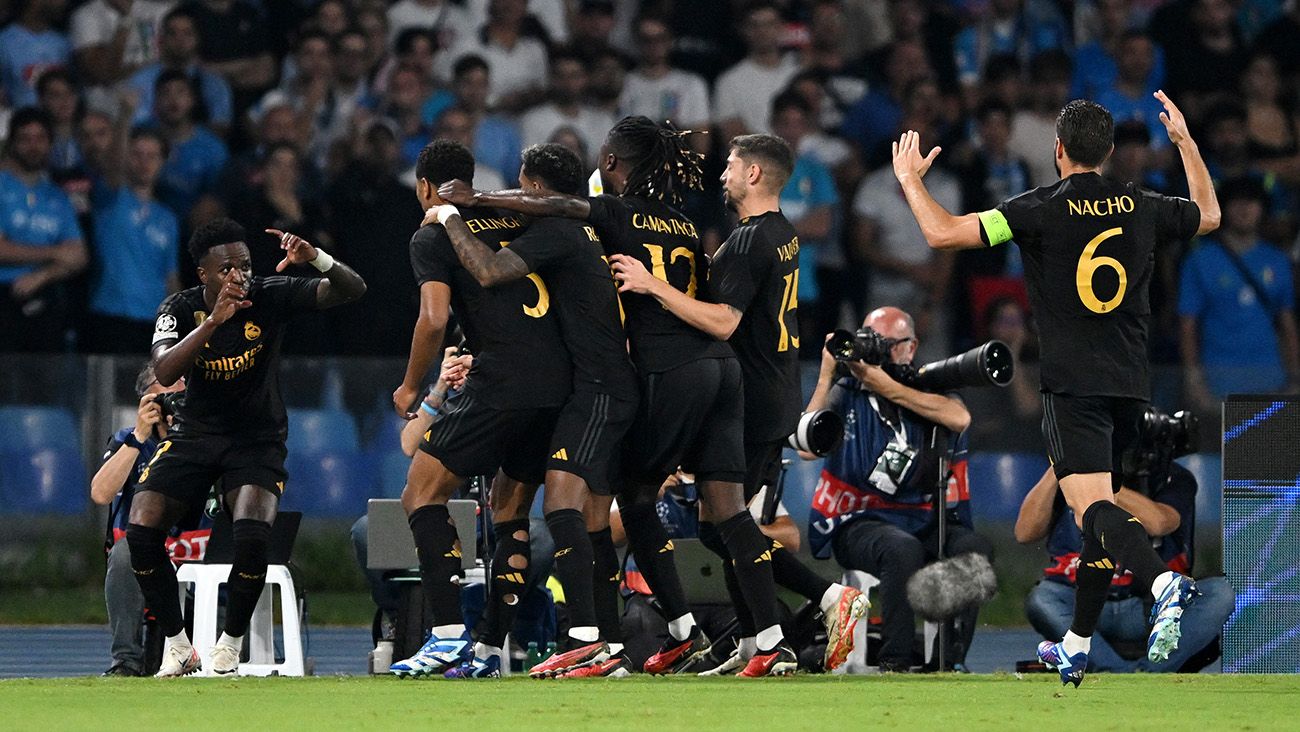 Real Madrid players celebrate one of their goals against Napoli