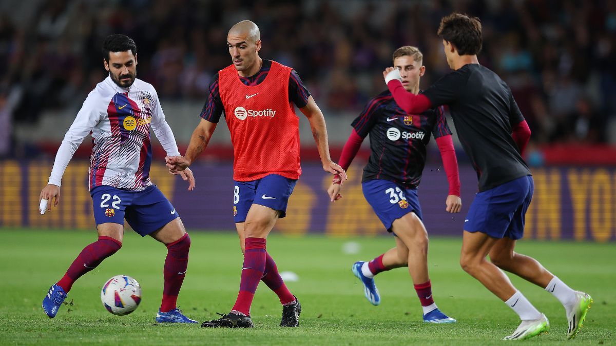 Oriol Romeu, Gündogan Fermín y Joao durante un calentamiento