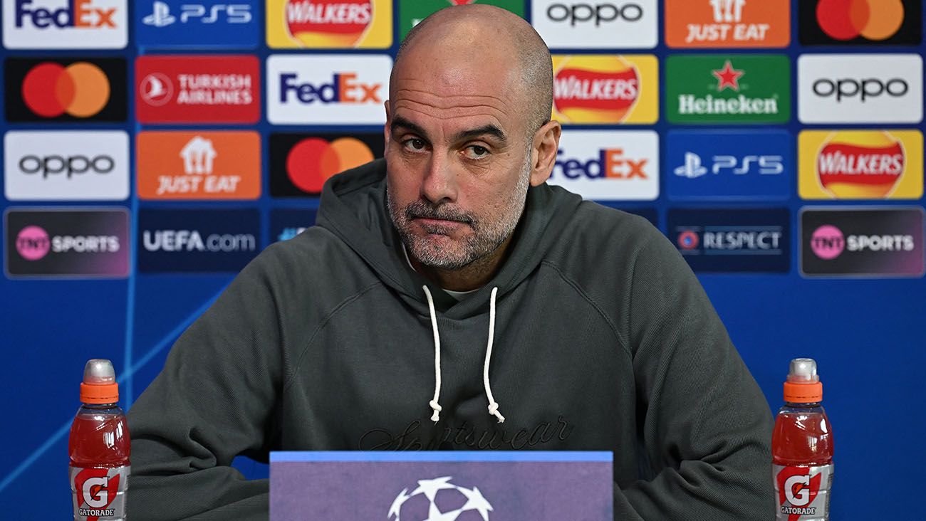 Pep Guardiola at a press conference with City