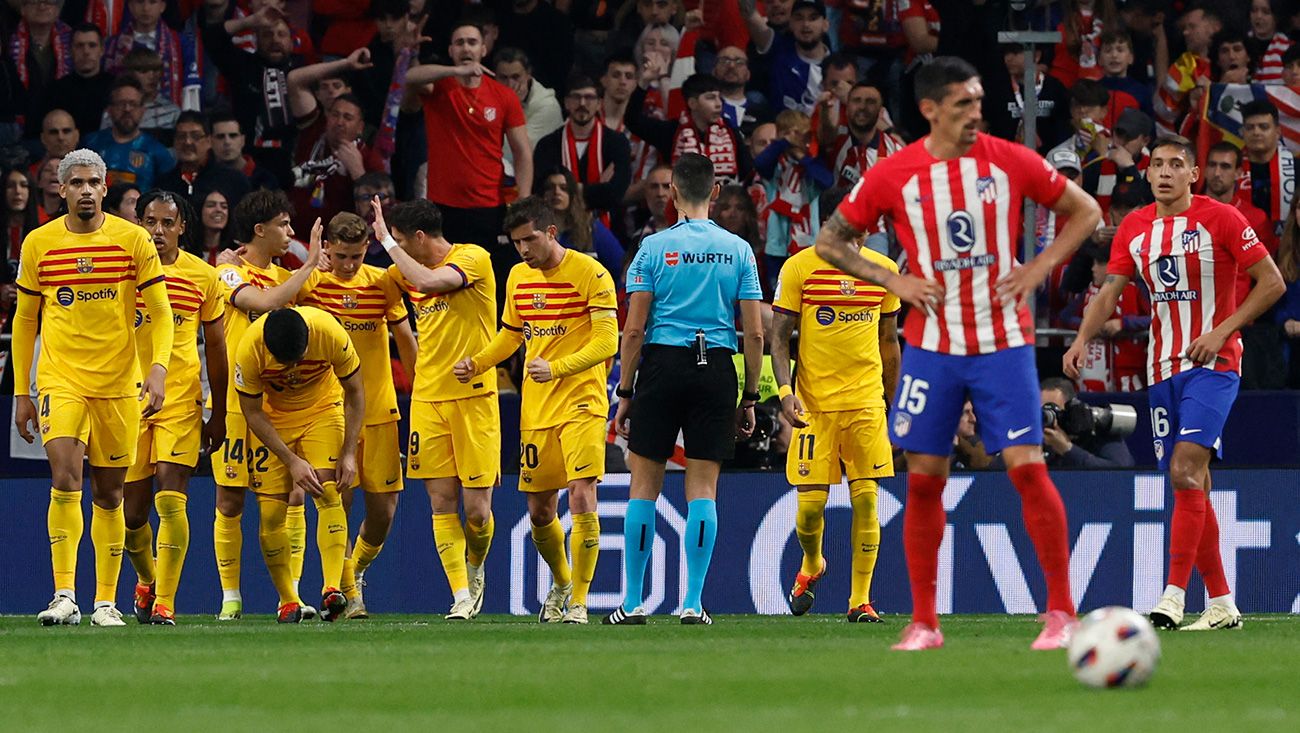 Barça players celebrate a goal against Atlético