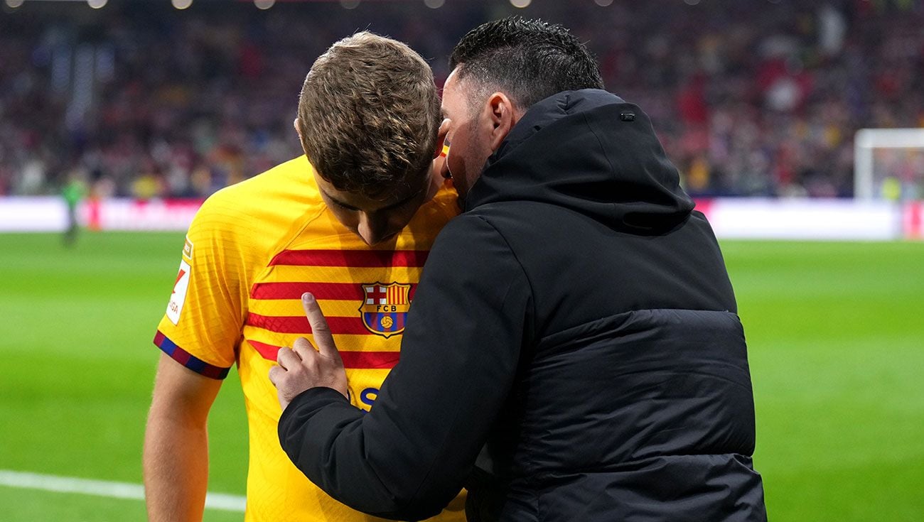 Fermín y Xavi durante un partido del Barça