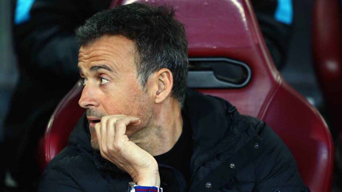 Luis Enrique, seated in the bench visitor