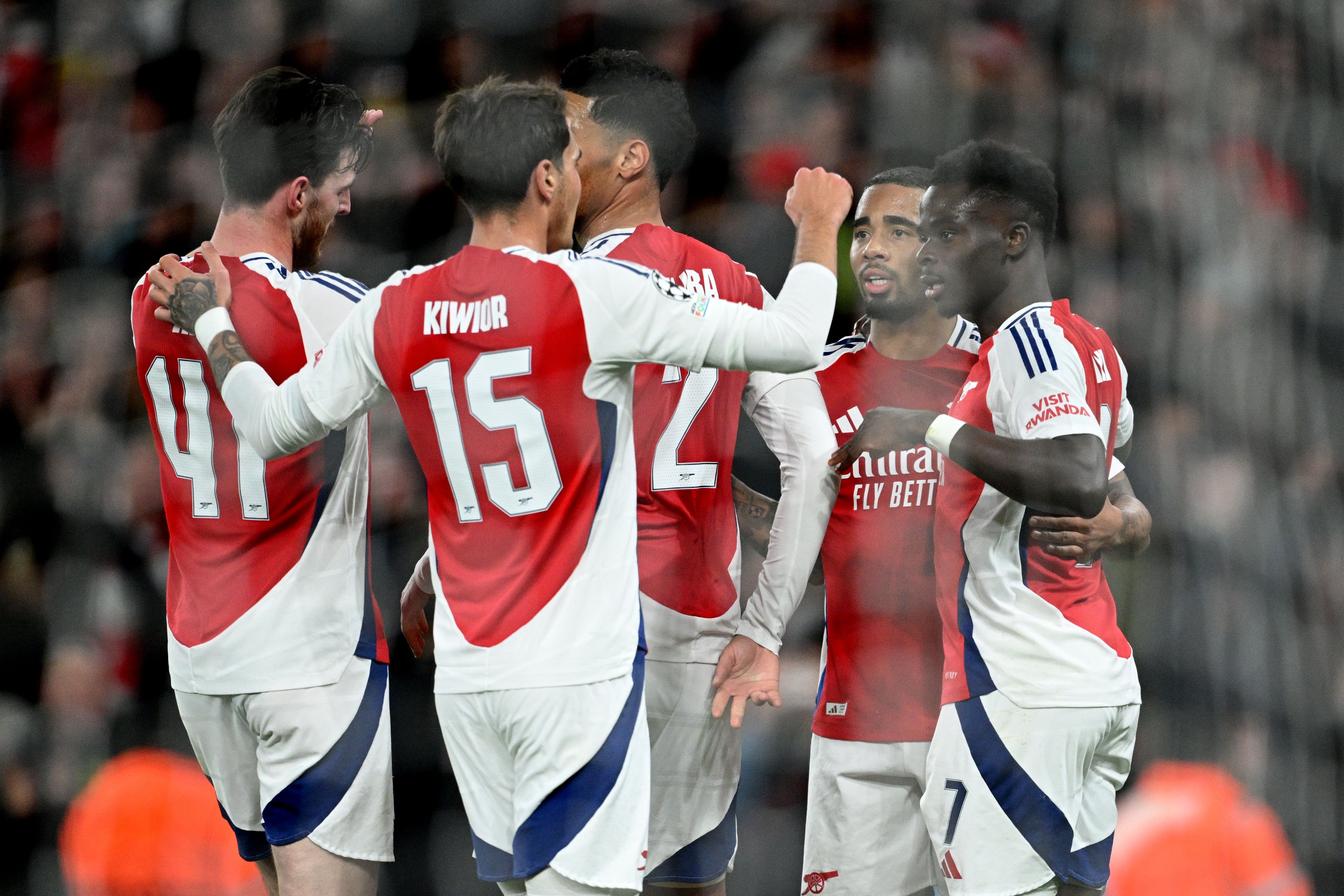 Arsenal players celebrating a goal against Monaco