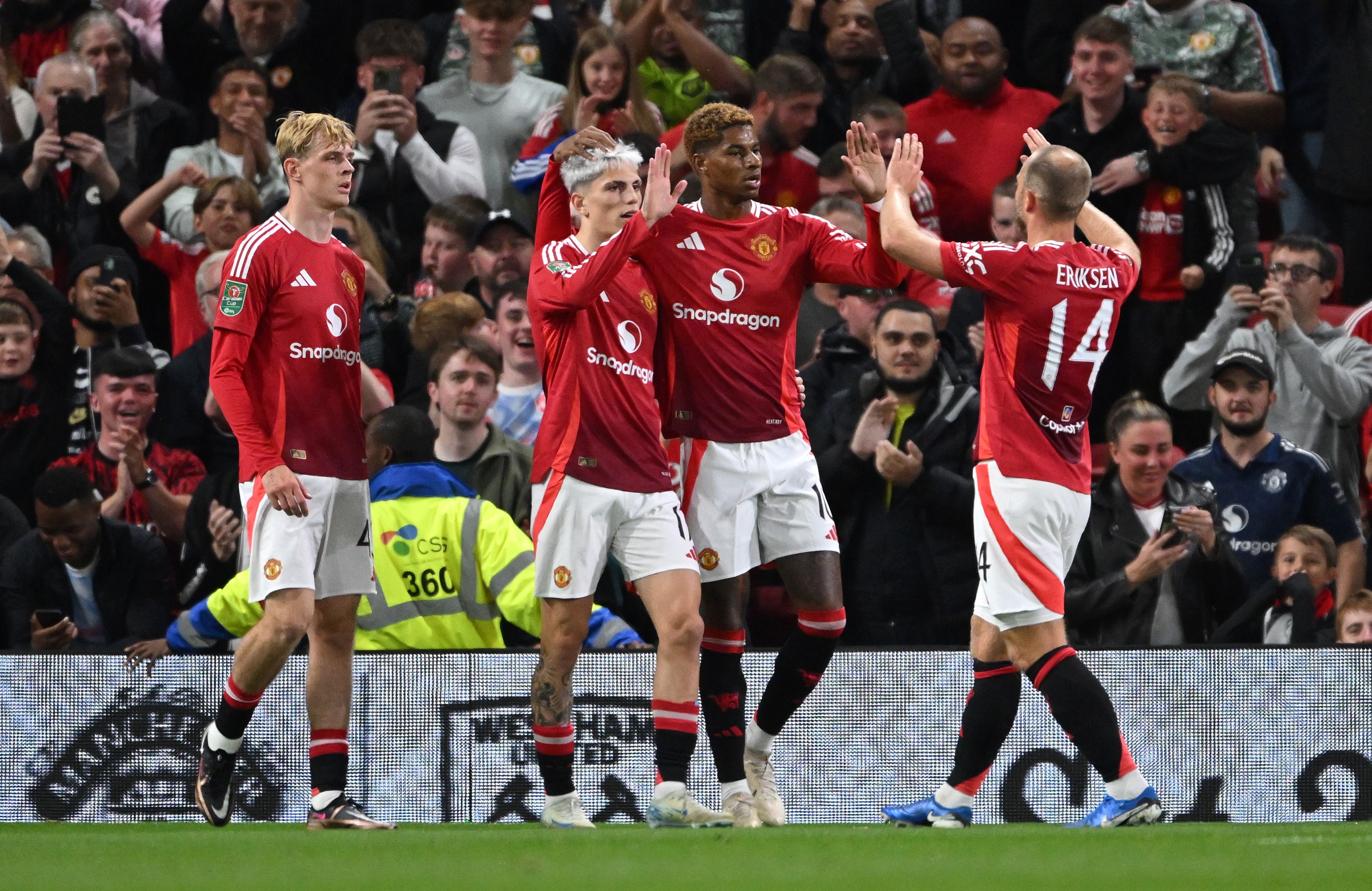 Manchester United players celebrating a goal against Barnsley
