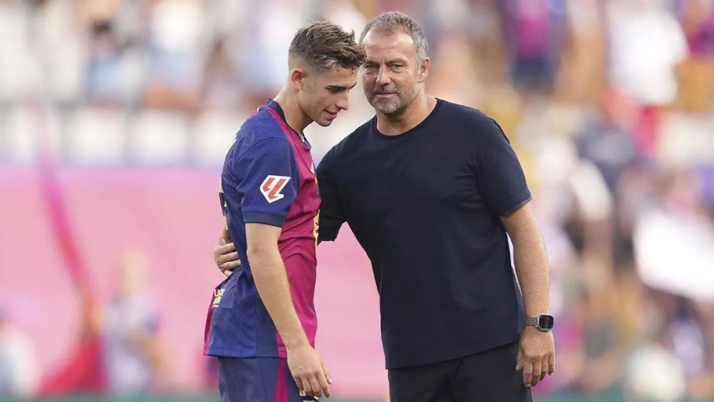 Fermín López junto a Hansi Flick Fermín López junto a Hansi Flick