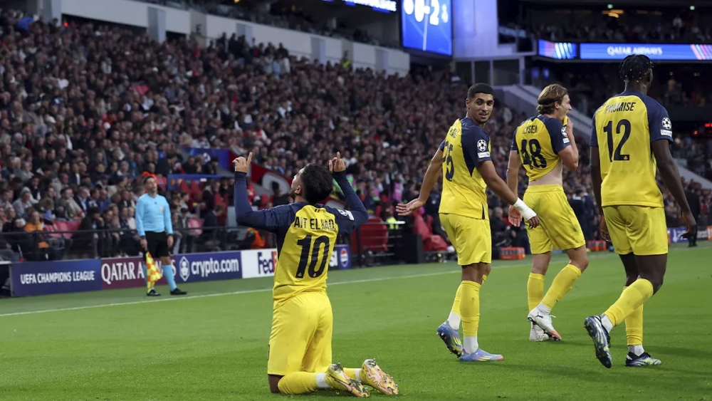 Union Saint-Gilloise players celebrating a goal against PSV (1-3)