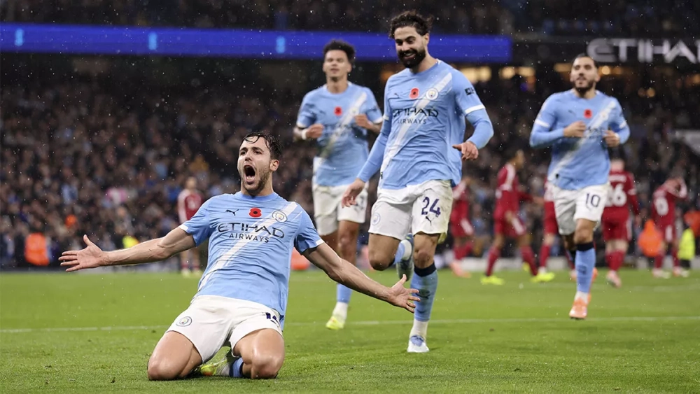 Nico González celebrating his goal against Liverpool