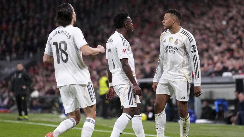Real Madrid players celebrating one of Mbappé's goals against Athletic