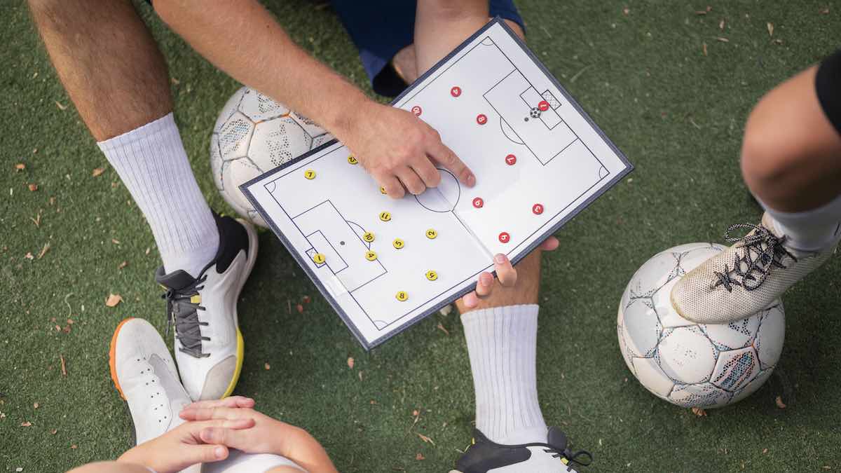 football trainer teaching his pupils