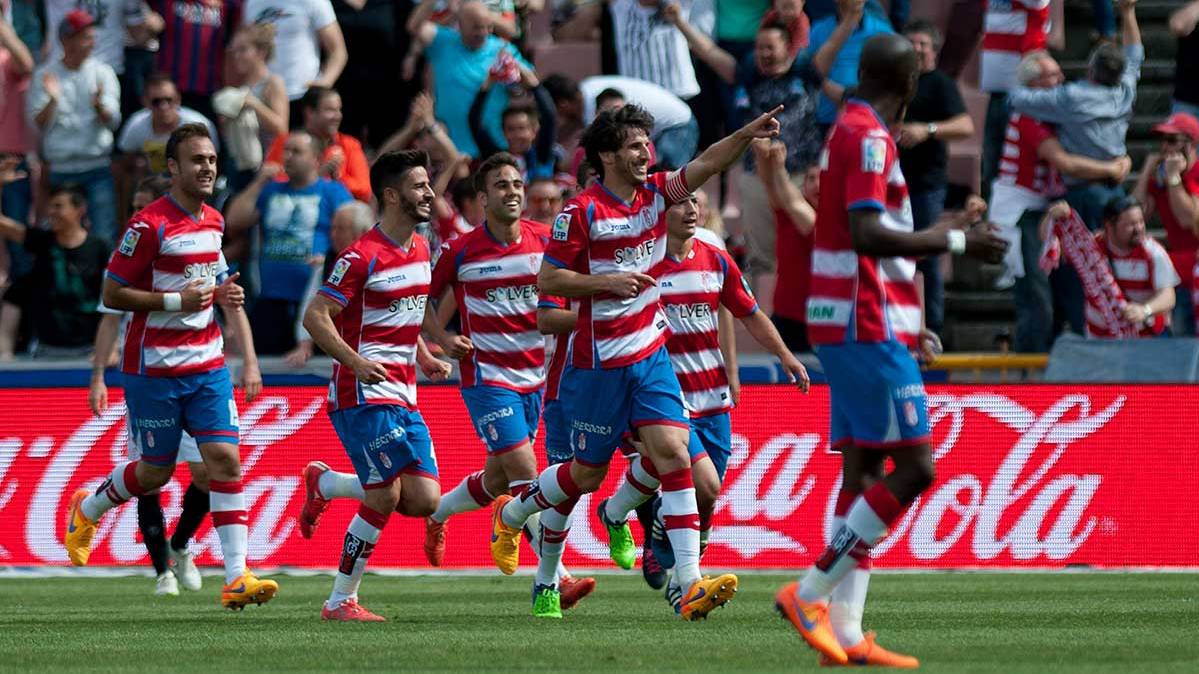 The players of the Granada celebrating a goal in front of the Seville