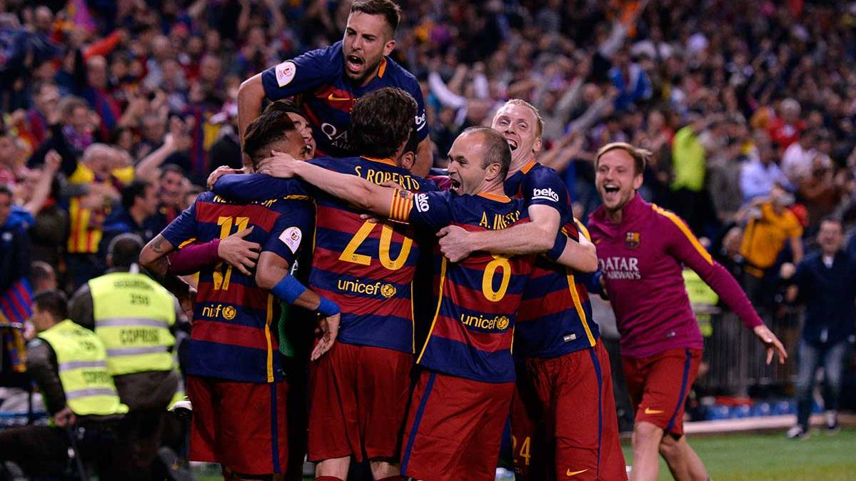 The players of the FC Barcelona celebrate the second goal in front of the Seville in the final of Glass