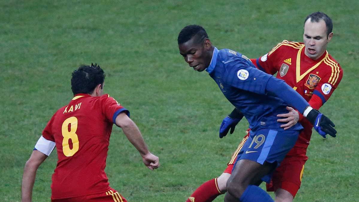 Paul Pogba and Andrés Iniesta in a France-Spain in 2013