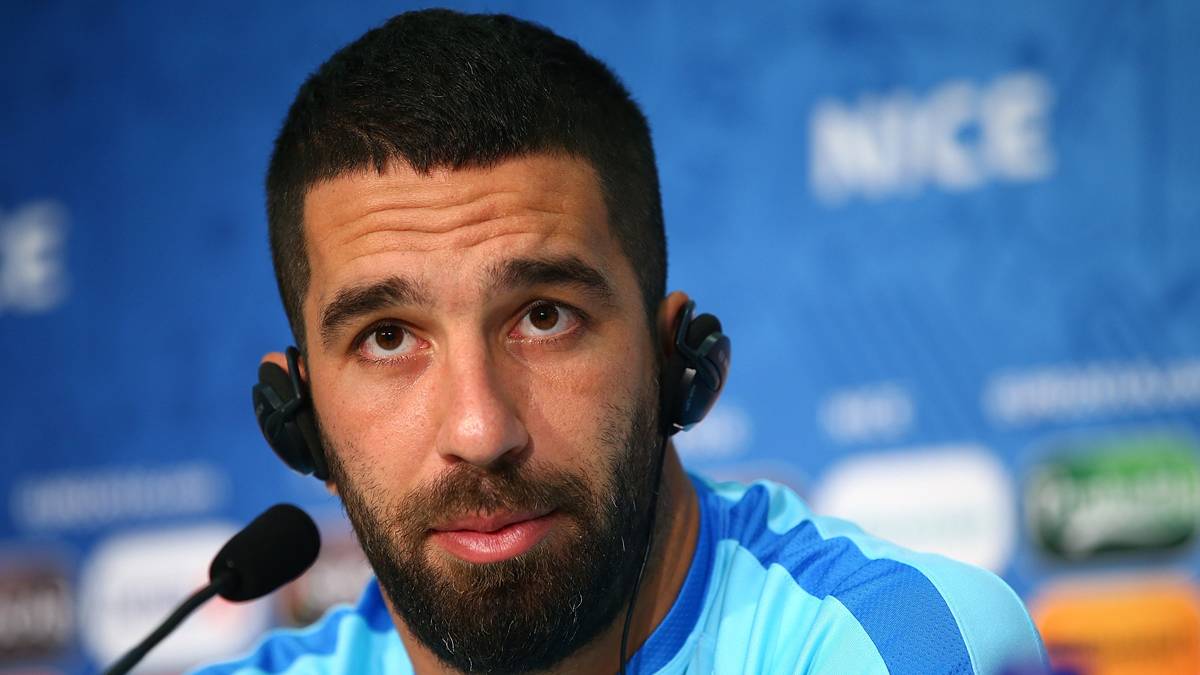 Burn Turan, appearing in press conference with Turkey