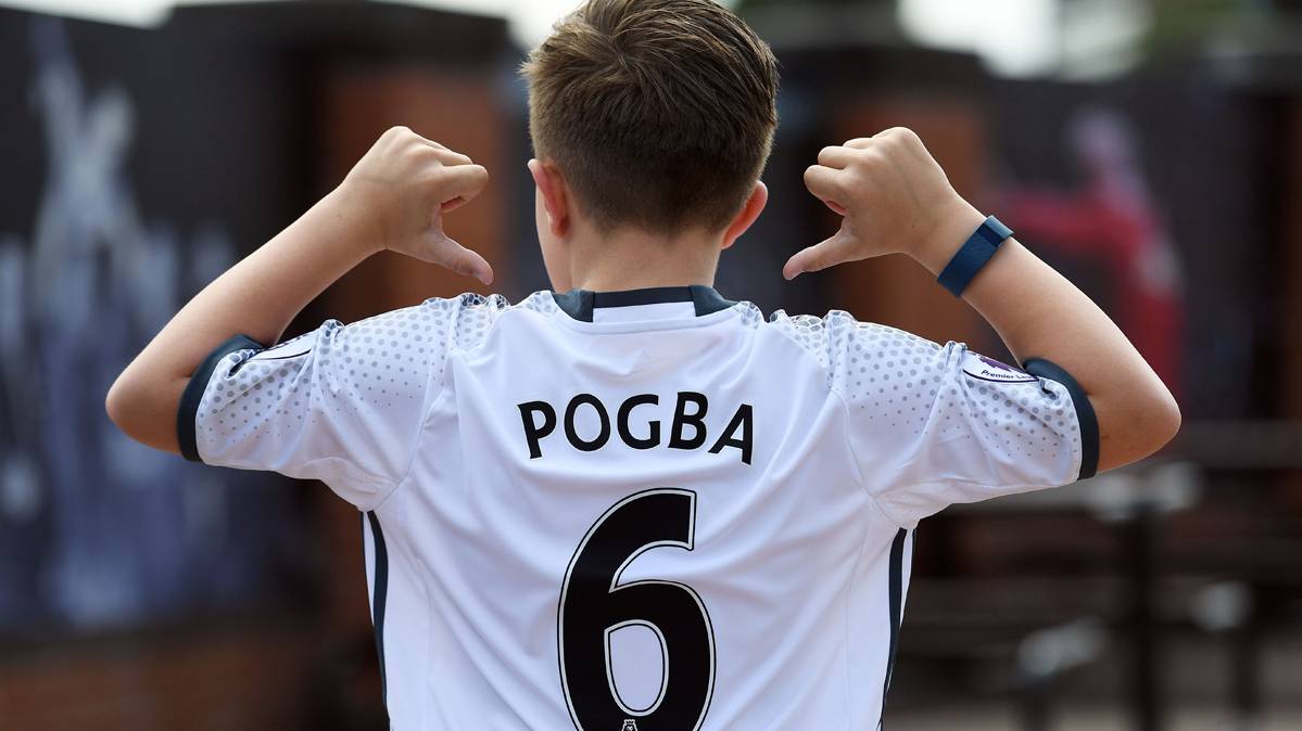 Young fan, dressed with the T-shirt of Paul Pogba