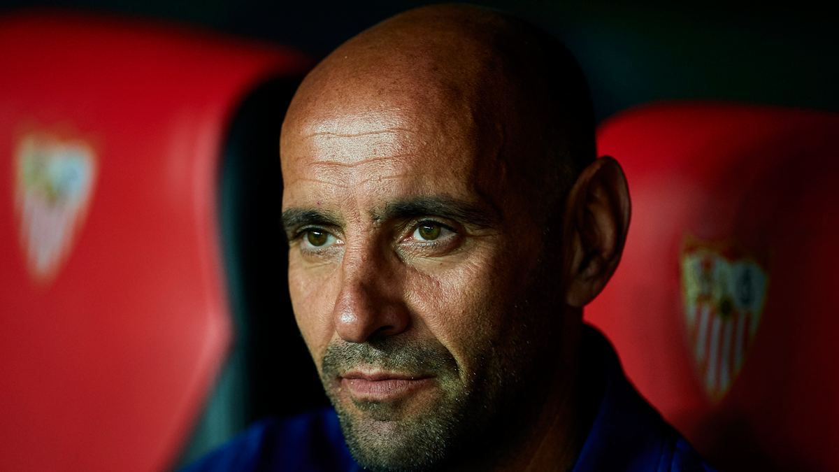Monchi, sportive director of the Seville, seated in the bench