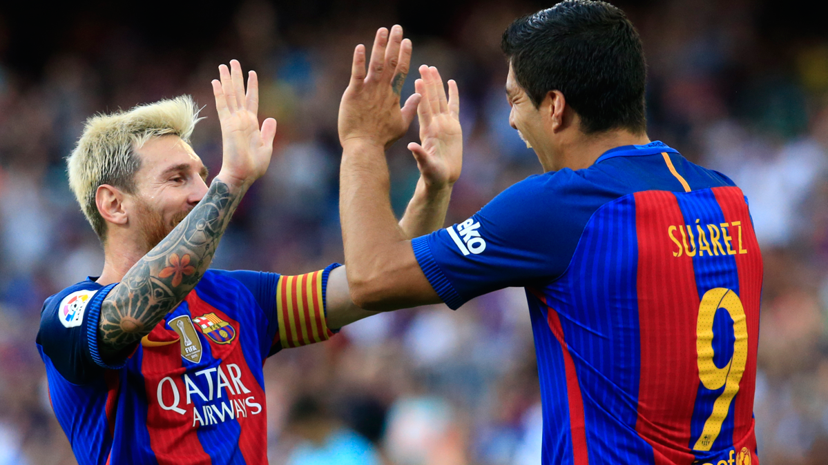 Leo Messi and Luis Suárez, celebrating a goal in a party of the FC Barcelona