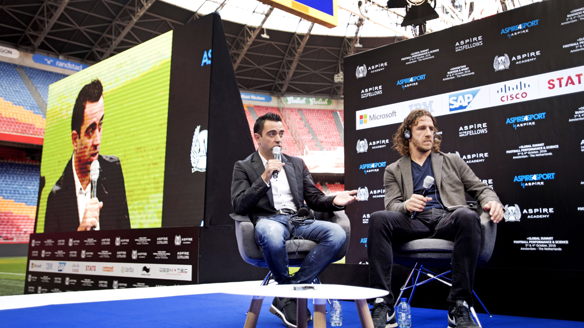 Xavi Hernández and Carles Puyol, in a conference of Aspire