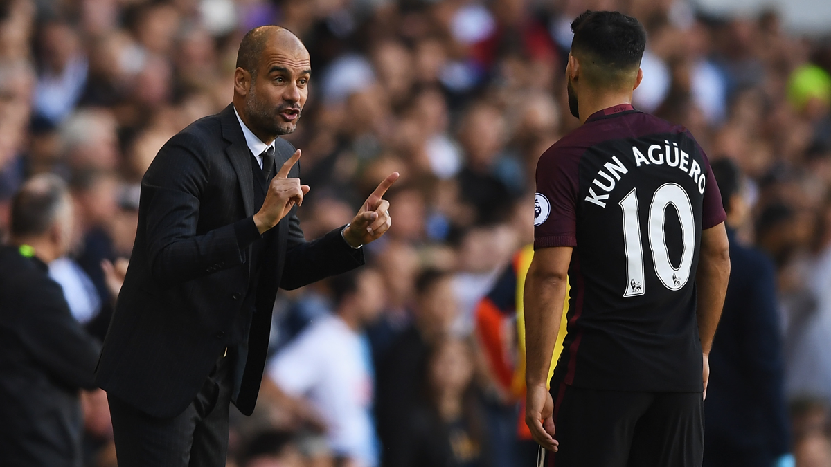 Pep Guardiola, chatting with Sergio Agüero in half of a party