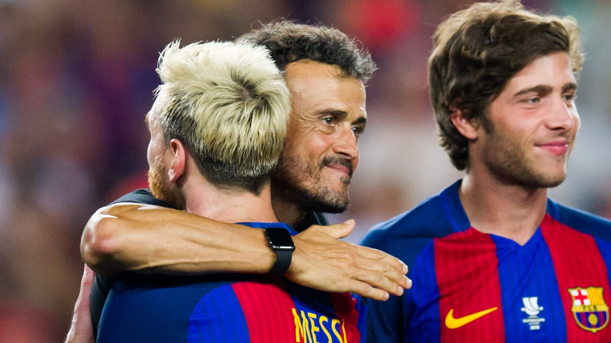 Luis Enrique and Leo Messi, embracing after winning the Supercopa of Spain