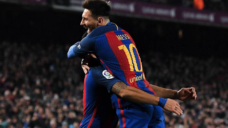 Leo Messi, celebrating a goal beside Luis Suárez