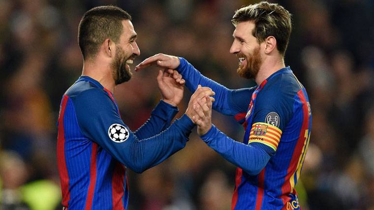 Burn Turan, celebrating a goal beside Leo Messi