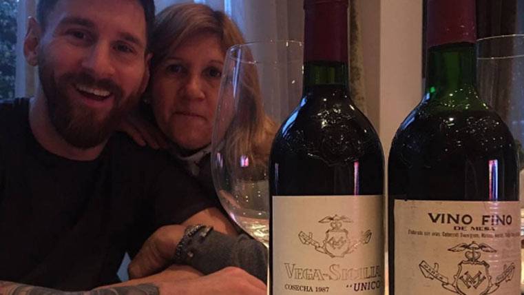 Leo Messi, celebrating the birthday of his mother with a bottle of wine