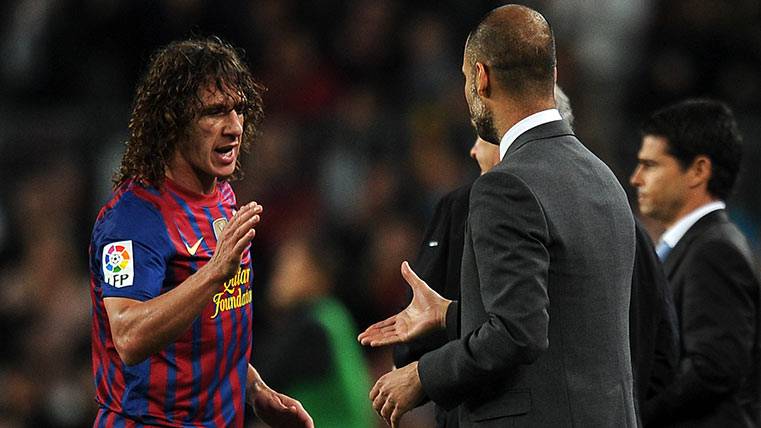 Carles Puyol, beside Pep Guardiola in a party of the Barça
