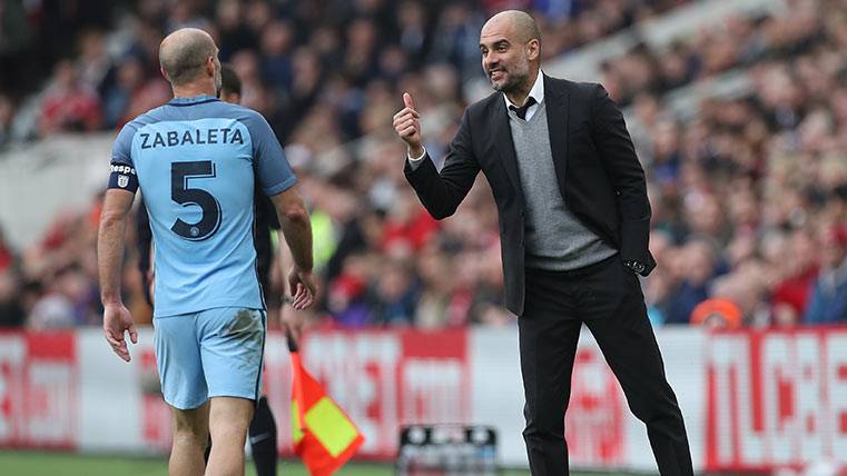 Pep Guardiola beside Pablo Zabaleta, in a party of the Manchester City