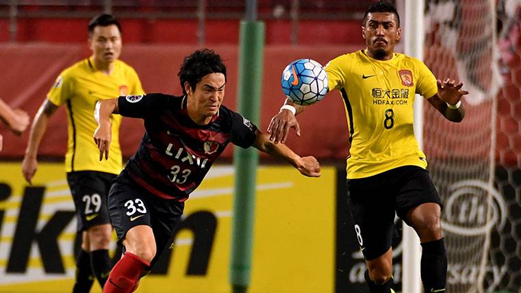 Paulinho In an action with the Guangzhou Evergrande