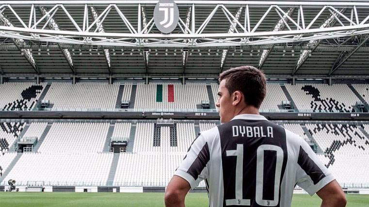 Paulo Dybala poses in the Juventus Stadium with his recently premièred dorsal