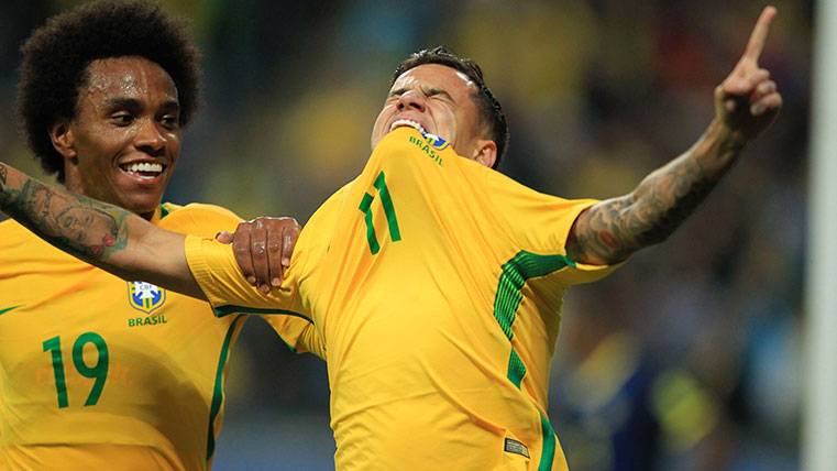 Philippe Coutinho celebrates a goal with Brazil