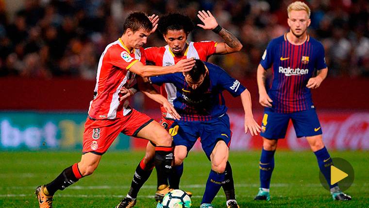 Leo Messi, intentando regatear a algunos jugadores del Girona