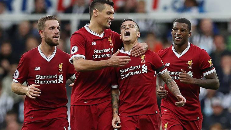 Philippe Coutinho, celebrating a goal with his mates in the Liverpool