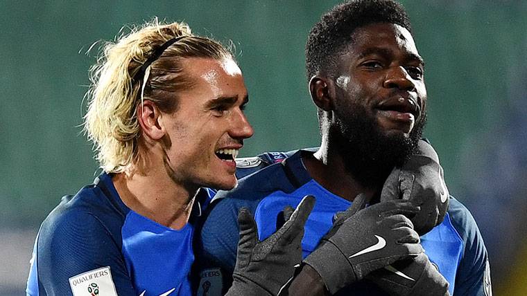Antoine Griezmann and Samuel Umtiti, celebrating a goal in France