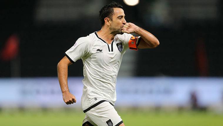 Xavi Hernández celebrates a goal with the To the-Sadd of Qatar