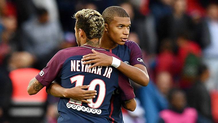 Kylian Mbappé And Neymar Jr, greeting during a party of the PSG