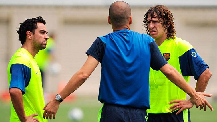 Xavi Hernández, Pep Guardiola and Carles Puyol in a training of the Barça