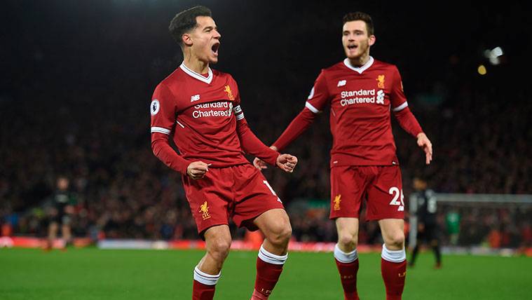 Philippe Coutinho celebrates a goal with the Liverpool