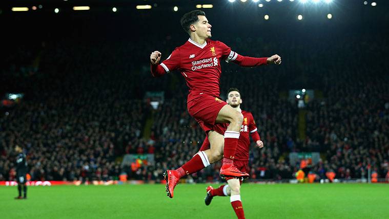 Philippe Coutinho celebrates a goal with the Liverpool