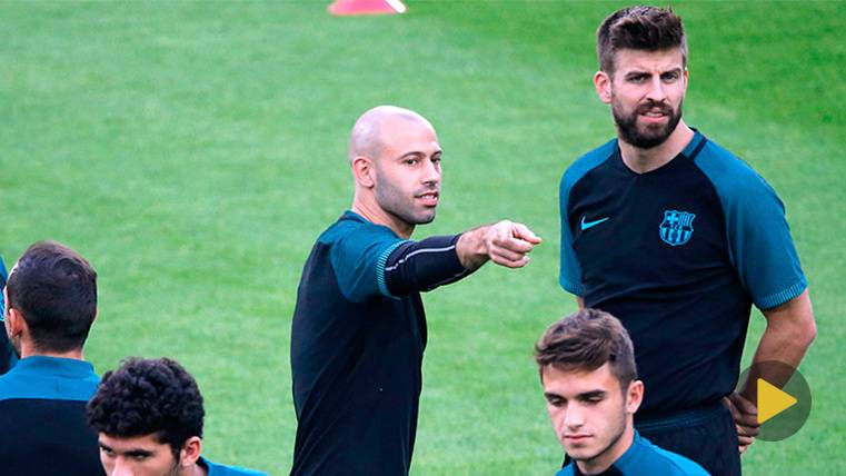 Javier Mascherano and Gerard Hammered in a training of the FC Barcelona