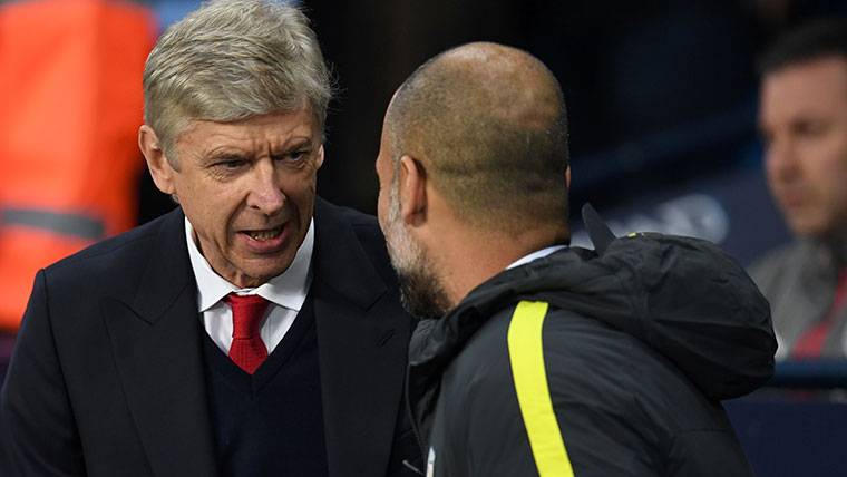 Arsène Wenger and Pep Guardiola, chatting after a party