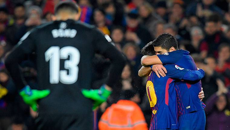 Luis Suárez, celebrating one of his goals with Leo Messi